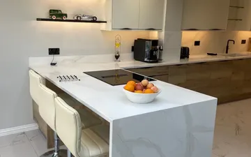 Completed Surrey Interiors kitchen with a waterfall island